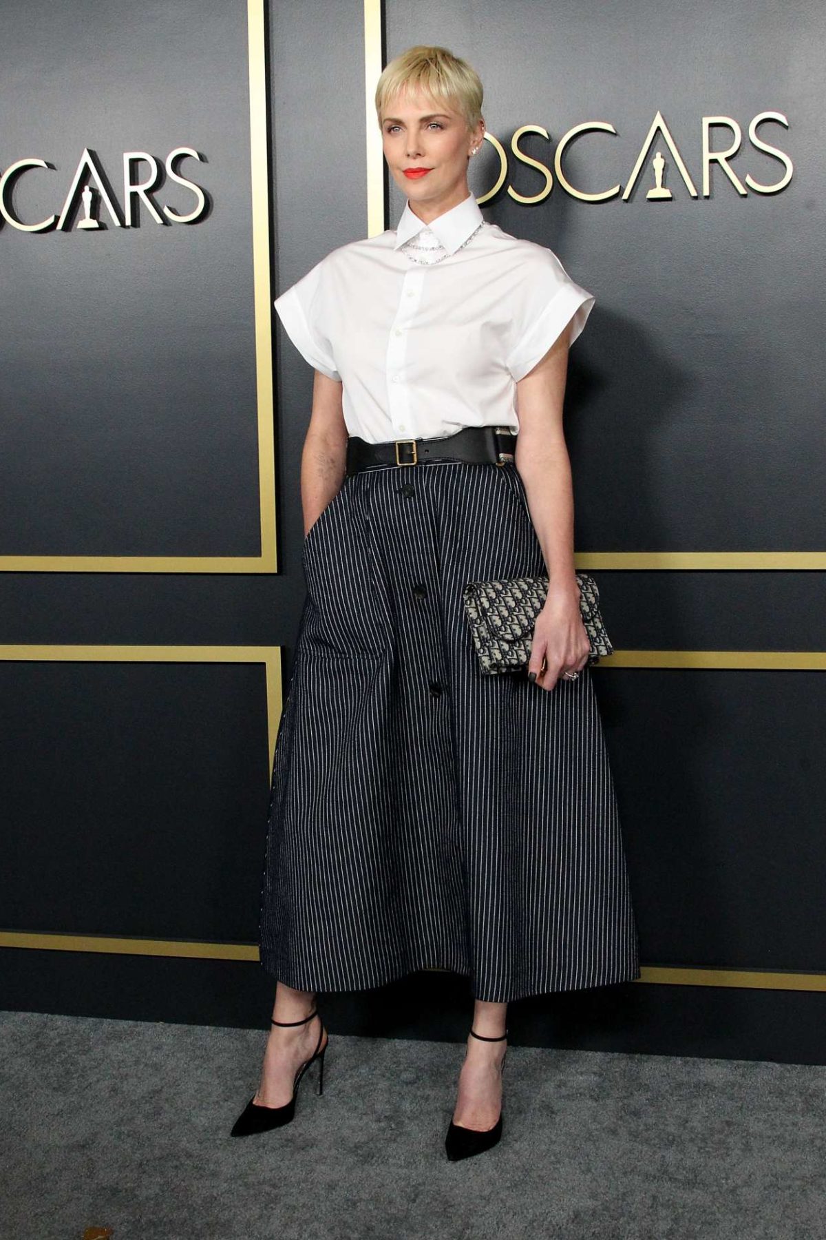 Charlize Theron, Celebrity OOTD,  Black Skirt, White Top Outfit